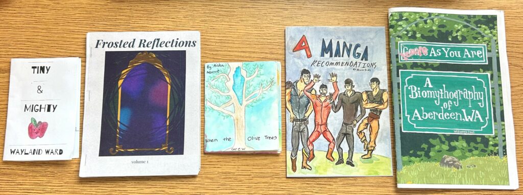 the 5 winning zines for the 9th annual washington state zine contest. Tiny and Mighty, Frosted Reflections, When the Olive Trees Grew, 4 Manga Recommendations, and Leave As You Are: A Biomythography of Aberdeen, WA.